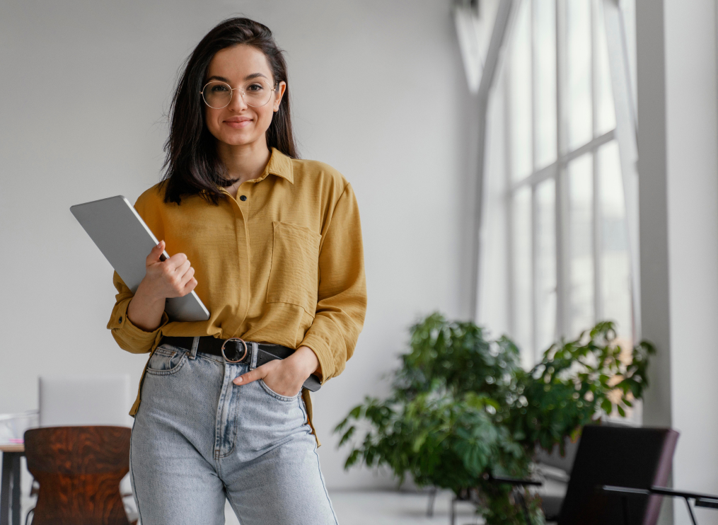 Brunet woman standing with laptop representing takealot ads increasing sales conversion